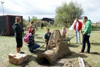 Festival Market - building a clay pottery oven