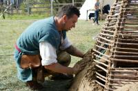 Festival Market - building a clay pottery oven